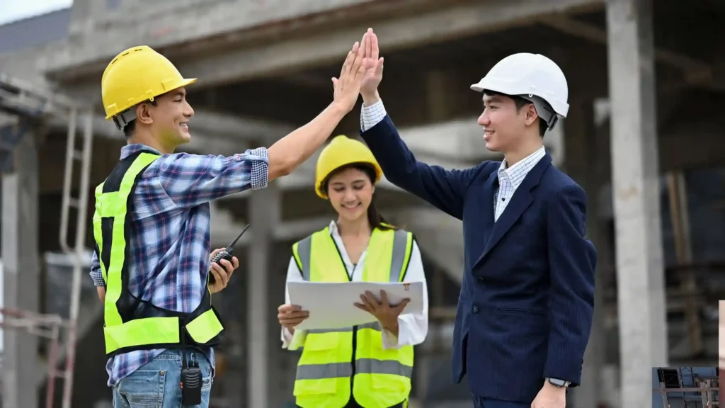 Construction professionals celebrating the successful completion of types of foundation in construction